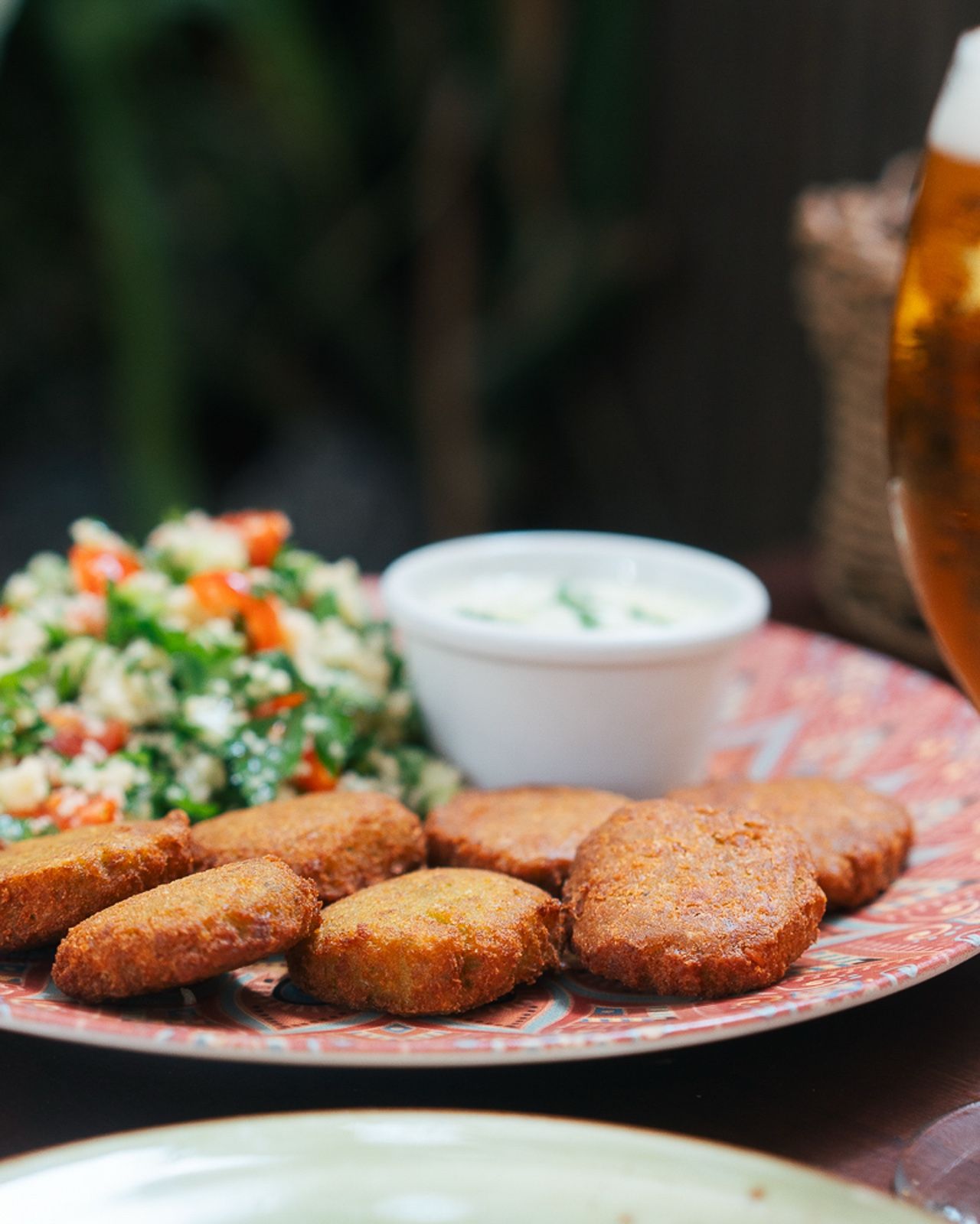 Home-made falafel with tabbouleh and yoghurt sauce