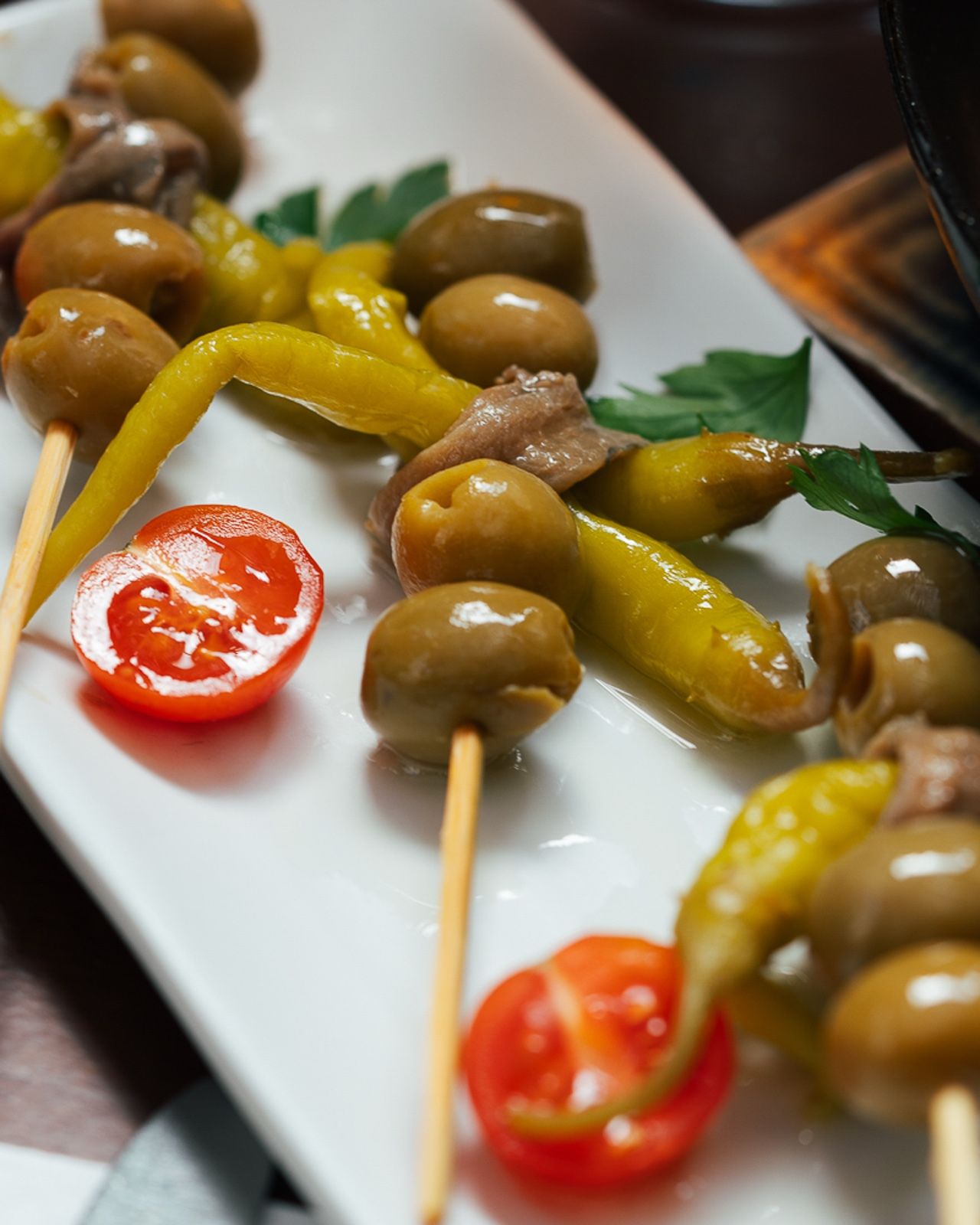 Anchovy, olive and piparra gildas on skewers